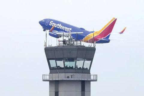 A Southwest Airlines passenger jet takes off from Chicago’s Midway Airport as flight delays stemming from a computer outage at the Federal Aviation Administration brought departures to a standstill across the U.S earlier Wednesday in Chicago. (CHARLES REX ARBOGAST/Associated Press)