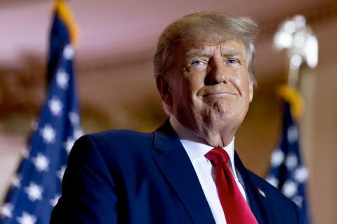 Former President Donald Trump announces he is running for president for the third time as he smiles while speaking at Mar-a-Lago on Nov. 15, 2022. (ANDREW HARNIK/Associated Press)