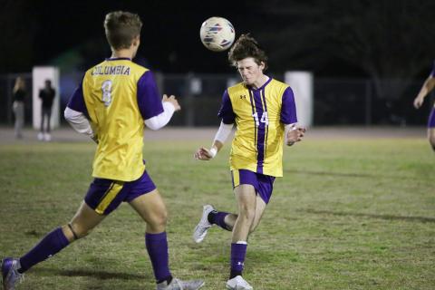 Columbia’s Bobby Shotwell heads a ball Tuesday night against Palatka. (BRENT KUYKENDALL/Lake City Reporter)