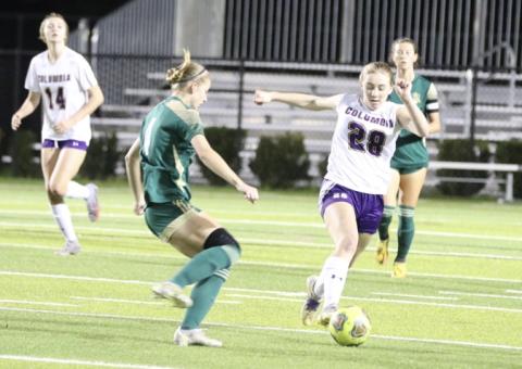 Columbia’s Kyndall Norris dribbles past Lincoln’s Izzy Young during Wednesday’s District 2-5A championship in Tallahassee. (MORGAN MCMULLEN/Lake City Reporter)