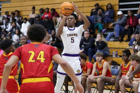 Columbia guard Jerome Carter shoots against Baker County on Friday night. (BRENT KUYKENDALL/Lake City Reporter)