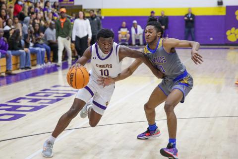 Columbia guard Isaac Broxey drives to the basket against Rickards during the District 2-5A championship on Friday. (BRENT KUYKENDALL/Lake City Reporter)