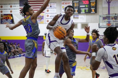 Columbia guard Isaac Broxey flies to the basket for a shot against Rickards during the District 2-5A championship last Friday. (BRENT KUYKENDALL/Lake City Reporter)