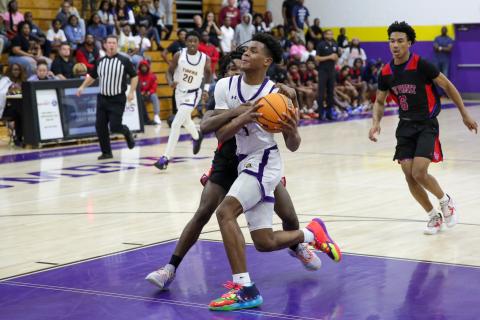 Columbia guard Jerome Carter is fouled in transition by Pine Forest during Thursday’s Region 1-5A quarterfinal. (BRENT KUYKENDALL/Lake City Reporter)