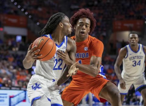 Kentucky guard Cason Wallace drives against Florida guard Niels Lane on Wednesday in Gainesville. (ALAN YOUNGBLOOD/Associated Press)