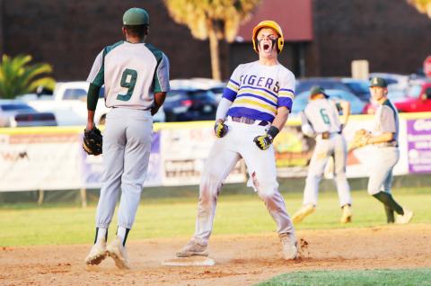 Columbia catcher Hayden Gustavson celebrates at second base after hitting a double against Lincoln  during last season’s Region 1-5A championship. (BRENT KUYKENDALL/Lake City Reporter)
