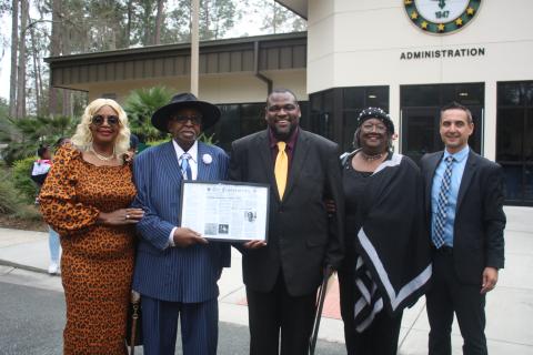 Mercilee Brown (from left) and her Rodney Brown, the first African American student to attend Lake City Junior College stand with Travis George, Lelia Williams and Tony Cardenas during an FGC Black History Month Proclamation ceremony on Tuesday morning. (TONY BRITT/Lake City Reporter)