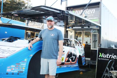 Jonathan Davenport with his No. 49 car. (TONY BRITT/Lake City Reporter)