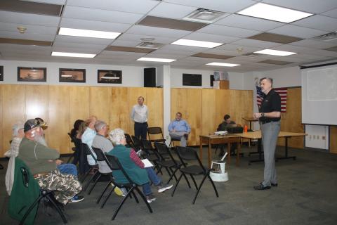 Gerry Dedenbach (standing, far right), CHW executive vice president, details plans for Hunter’s Creek, a planned residential development, that could be built across from the southern entrance of the Southside Sports Complex. (TONY BRITT/Lake City Reporter)