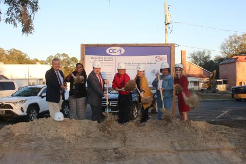 Columbia County Superintendent Lex Carswell (from left), Fort White Elementary Principal Syreeta Jackson-Lee, and school board members Hunter Peeler, Keith Hudson, Dana Brady-Giddens, Narrie Smith, and Cherie Hill take part in the ceremonial groundbreaking at Fort White Elementary Tuesday. (TONY BRITT/Lake City Reporter)