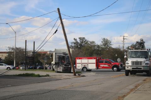 A power pole near the intersection of Duval Street and Hernando Avenue was snapped near its base Thursday afternoon after a semi truck backed into it. (TONY BRITT/Lake City Reporter)