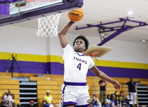 Columbia forward Ty’jahn Wright rises for a dunk against Pine Forest during the Region 1-5A quarterfinals on Thursday. (BRENT KUYKENDALL/Lake City Reporter)
