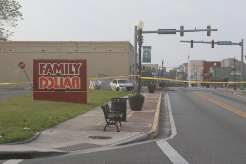 A car crashed through a traffic signal control box before slamming into the traffic signal early Friday morning. A passenger was seriously injured and the roadway was closed for hours. (JAMIE WACHTER/Lake City Reporter)