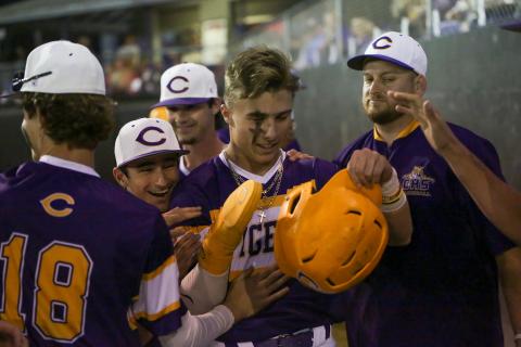 Columbia outfielder Camdon Frier is congratulated by teammates after scoring a run against Valdosta on March 16. (BRENT KUYKENDALL/Lake City Reporter)