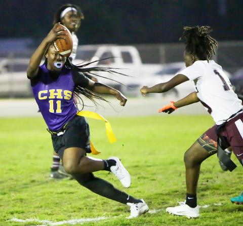 Columbia quarterback Eriel Baker scrambles away from defensive pressure against Madison County on Tuesday night. (BRENT KUYKENDALL/Lake City Reporter)
