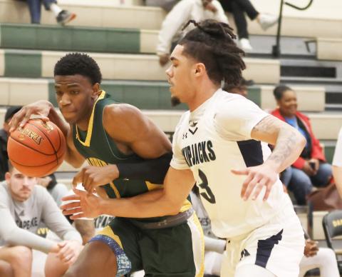FGC guard Jeremiah Barze dribbles while being defended by Chesapeake guard  Izaiah Credle during Wednesday's consolation game in the NJCAA tournament. (COURTESY OF NJCAA)