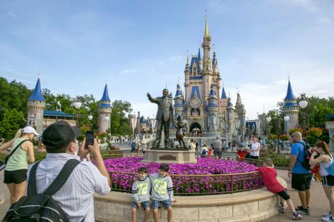 People visit the Magic Kingdom Park at Walt Disney World Resort in Lake Buena Vista on April 18, 2022. (TED SHAFFREY/AP File)