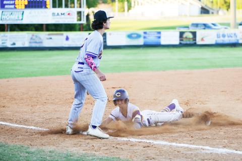 Columbia’s Matt Dumas slides safely into third base against Lake Weir on Wednesday night. (BRENT KUYKENDALL/Lake City Reporter)
