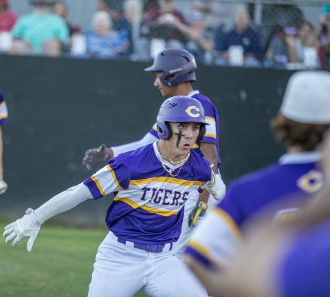 Columbia Camdon Frier celebrates after hitting a grand slam against Santa Fe on Friday. (ALAN YOUNGBLOOD/Special to the Reporter) 