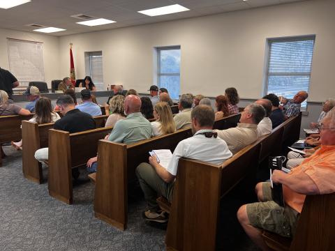 The Lafayette County Commission meeting room was packed Tuesday night for a discussion about a special exception for a travel trailer park. (JAMIE WACHTER/Lake City Reporter)