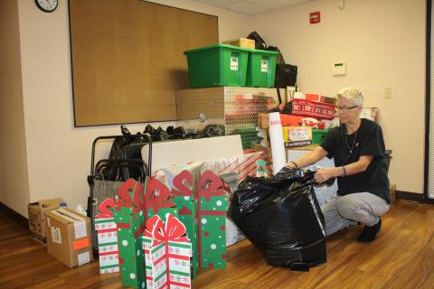 Toys for Tots coordinator Inga Dwyer packs up supplies ahead of the organization’s move out of Lake Shore Hospital property. (TONY BRITT/Lake City Reporter)