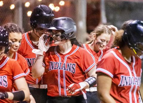 Fort White pitcher Kadence Compton celebrates with teammates after hitting a home run against Lafayette on Tuesday night. (JACK HOWDESHELL/Special to the Reporter)