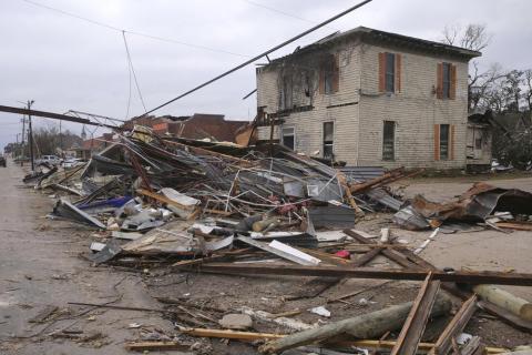 Debris from local businesses covers the street in Selma, Ala., on Jan. 13 after a tornado passed through the area. After three nasty years, the La Nina weather phenomenon is gone, the National Oceanic and Atmospheric Administration said Thursday. (STEW MILNE/AP file)
