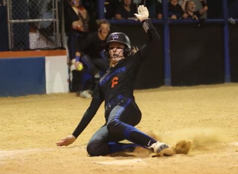 Branford’s Madyson Sikes slides into home plate to score the game-winning run against Suwannee on April 11. (PAUL BUCHANAN/Special to the Reporter)