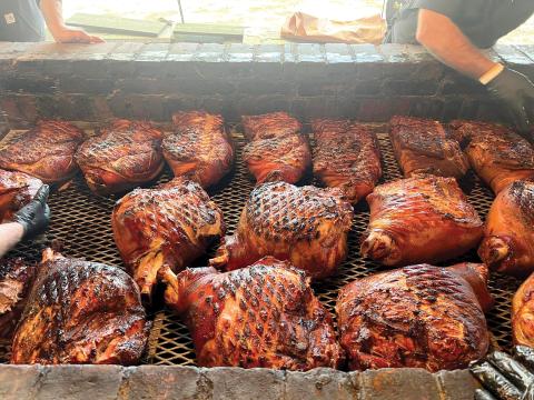 Meat sits on the smoker at Jack’s Old South, the competitive cooking team led by Myron Mixon, the winningest man in barbecue. Mixon and Jack’s Old South are among the 32 teams competing at this weekend’s Downtown Showdown BBQ Cook-off in downtown Lake City. (COURTESY)