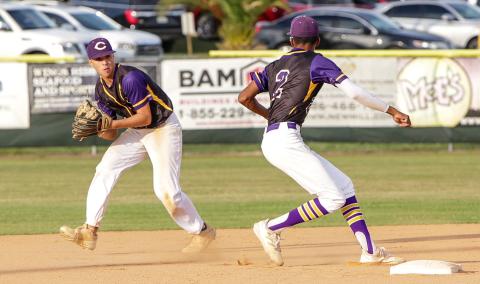 Columbia second baseman Grant Bowers sets to flip the ball to shortstop Brayden Thomas for an out against Union County on April 19. (BRENT KUYKENDALL/Lake City Reporter)