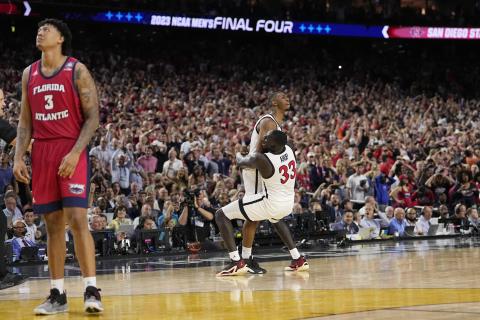 San Diego State guard Lamont Butler celebrates after scoring the game-winning basket with forward Aguek Arop (33) during the Final Four against Florida Atlantic on Saturday in Houston. (DAVID J. PHILLIP/Associated Press)