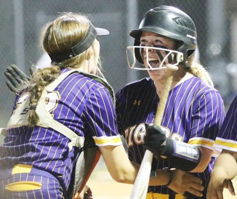 Columbia second baseman Alex Collins (right) celebrates with catcher Emily Delgado after hitting a walk-off RBI single against Taylor County on Thursday night. (JORDAN KROEGER/Lake City Reporter).
