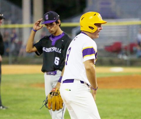 Columbia’s Waylon Fulford celebrates on third base after hitting an RBI triple against Gainesville on Friday night. It was Fulford’s first career hit. (BRENT KUYKENDALL/Lake City Reporter)