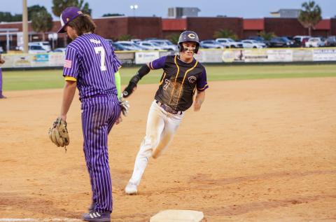Columbia’s Hayden Gustavson turns off third base to head home for a run against Union County on Wednesday night. (BRENT KUYKENDALL/Lake City Reporter)