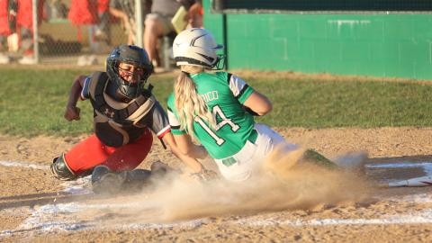 Suwannee’s Braylyn Federico is tagged out at home plate by Santa Fe catcher Madie Crosby on Tuesday night. (PAUL BUCHANAN/Special to the Reporter)