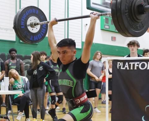 Suwannee’s Chris Gonzalez performs the clean and jerk during the Region 2-1A meet on Friday. Gonzalez won regional titles in the traditional and Olympic in the 119 weight class to qualify for state in both events. (PAUL BUCHANAN/Special to the Reporter)