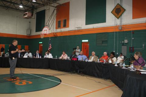 Lake City Police Chief Gerald Butler discusses combined dispatch at Tuesday’s joint city-county meeting. (TONY BRITT/Lake City Reporter)