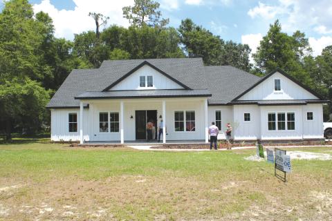 Folks wait to take a tour of one of the houses on the 2022 Parade of Homes route. This year’s Parade of Homes will run from April 29-30 and is free to the public to attend and tour. (FILE)