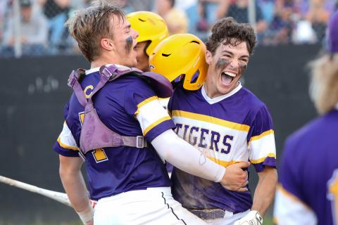 Columbia outfielder Carston Palmer (right) celebrates with catcher Hayden Gustavson after scoring a run against Pine Forest during the Region 1-5A quarterfinals on Tuesday night. (BRENT KUYKENDALL/Lake City Reporter)