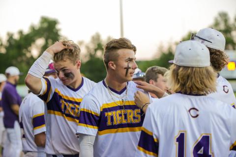 Columbia players regroup in the dugout after Camdon Frier (middle) hit a home run against Lincoln in the District 2-5A championship on Wednesday. (BRENT KUYKENDALL/Lake City Reporter)