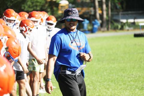 Branford head coach Tim Clark watches over conditioning at the end of practice on May 4. (JAMIE WACHTER/Lake City Reporter)