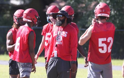 Lafayette head coach Marcus Edwards speaks with quarterback Tywan Williamson during practice on May 3. (MORGAN MCMULLEN/Lake City Reporter)