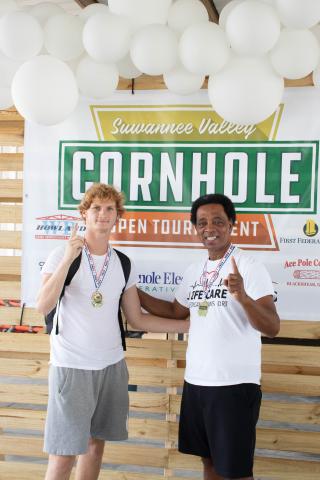 Ricky Nicky, the team of Lake City’s Nick Wilkerson (left) and Ricky Jernigan, won the competitive division at the Suwannee Valley Cornhole Tournament. (COURTESY)