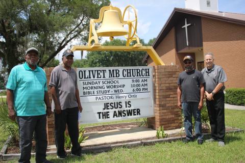Members of the Olivet Missionary Baptist Church military ministry (from left) Thomas Acree, Harold Perry, Sean Dunmore and church pastor Henry Ortiz placed a total of more than 2,000 flags in 17 local cemeteries in honor of veterans on Memorial Day. (TONY BRITT/Lake City Reporter)