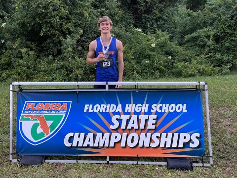 Branford’s Cash Blalock is pictured with his seventh-place medal in the high jump at the Class 1A state meet on Wednesday at Hodges Stadium in Jacksonville. (COURTESY)