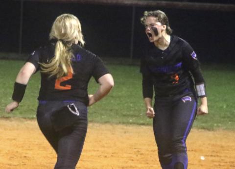 Branford pitcher Laila Arnold (left) races toward shortstop Cloey Criggall to celebrate their Region 3-1A semifinal win over Fort White on Thursday night. (MORGAN MCMULLEN/Lake City Reporter)