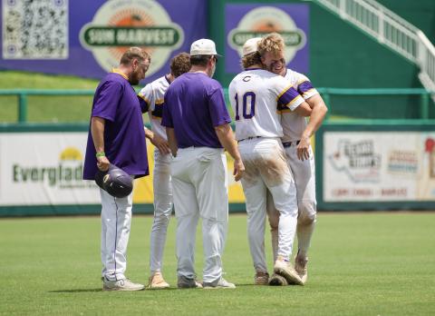Columbia pitcher Josh Fernald (10) and his coaches console catcher Hayden Gustavson following the Tigers' 5-2 loss to American Heritage in the Class 5A state semifinals on Monday at Hammond Stadium in Fort Myers. (JESSICA PILAND/Special to the Reporter) 