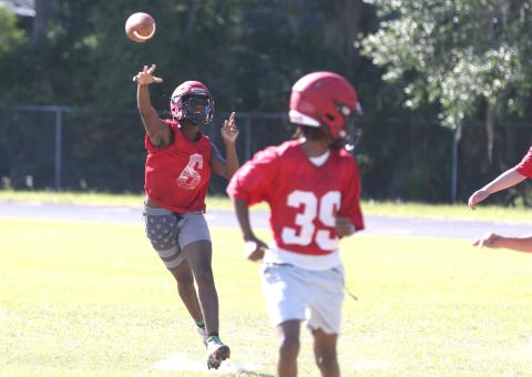 Lafayette quarterback Tywan Williamson tosses a pass during a rollout on the third day of the Hornets’ spring practices on Wednesday. Williamson, a rising sophomore, will be trusted with more of the playbook this upcoming season, according to head coach Marcus Edwards. (MORGAN MCMULLEN/Lake City Reporter)