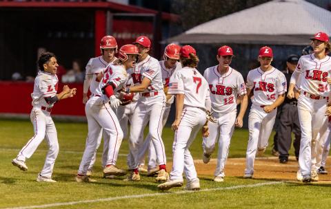 Lafayette’s Dawson Mock celebrates with teammates after hitting a grand slam against Wakulla Christian in the Region 3-1A semifinals on Wednesday night. (JACK HOWDESHELL/Special to the Reporter)