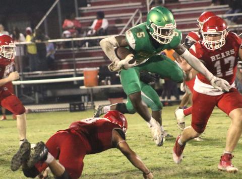 Suwannee receiver MJ Rossin jumps over a Dixie County defender Thursday night at Bruce Boyette Field. (JAMIE WACHTER/Lake City Reporter)